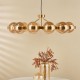 Dar-OPH1235 - Ophira - Antique Gold 12 Light Centre Fitting with Amber Ribbed Glass