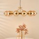 Dar-OPH1235 - Ophira - Antique Gold 12 Light Centre Fitting with Amber Ribbed Glass